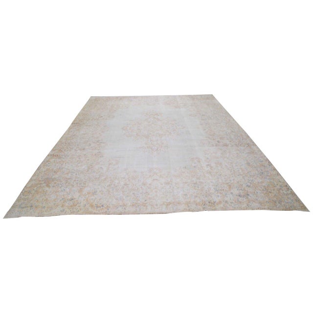 Hand-knotted with care using traditional rug-making techniques, this wool rug blends timeless craftsmanship with a modern...