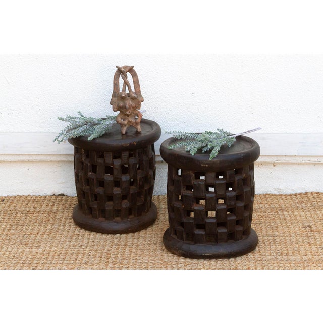 This matching pair of 16-inch high stools is an exceptional find from the Bamileke people of the Cameroon Grassfields....
