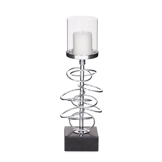 Our Ring Toss Candle Holder features iron rings encircling a central rod. The entire piece is finished in a silver...
