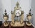 A monumental 19th Century Continental Neoclassical Style Brass and Marble Clock Garniture Set with working mantle clock...