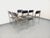 Six vintage chairs from the 1970s/80s, stackable, Italian design, black vinyl seats and backs, tubular chromed metal frame...