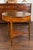 An English pine center table from the mid-19th century, with partitioned drawer, faux bamboo legs and triangular shelf....
