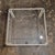 Small coffee table that also could be used as a corner or side table. Made from white lacquered metal it has a glass top....