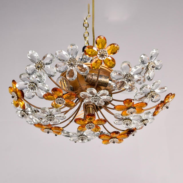 Found in France, this flush mount fixture in the style of Maison Bagues has a brass and gilt metal base with faceted...