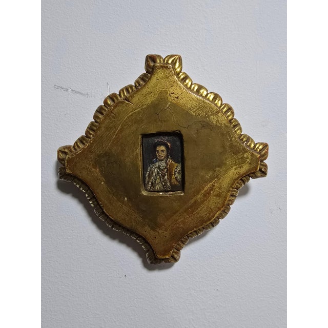 A delicate portrait of a Spanish figure from the early 19th century, painted on copper. The piece is elegantly framed in a...