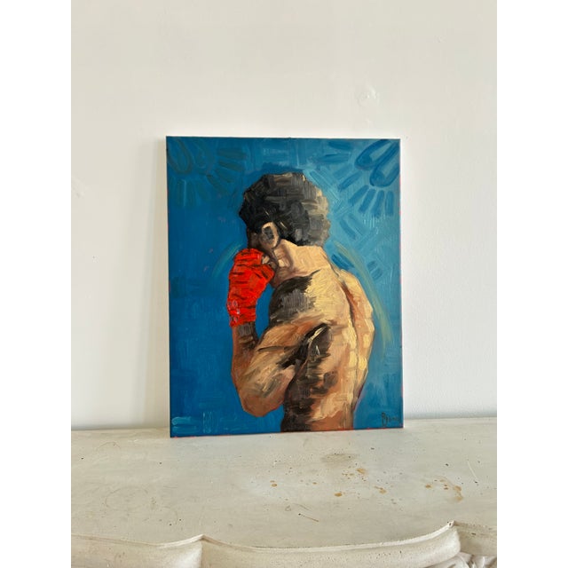 This painting focuses on a restrained form of strength. The figure is turned away, holding tension within the body. The...