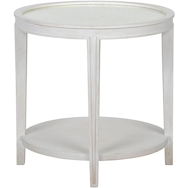 This classically elegant side table has been hand-carved of mahogany and topped with a circle of antiqued mirrored glass....