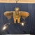 Stunning French carved gilt wood chandelier centered by a finely sculpted eagle with outstretched wings, perched above a...