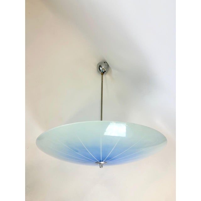 Large Mid-Century Umbrella Pendant Lamp from Napako, 1960s, in Very Good conditions. Designed 1960 to 1969 This piece has...
