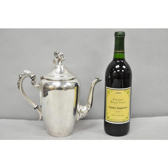 Vintage English Art Nouveau Silver Plated Tulip Floral Design Teapot. Circa Mid 20th Century. Measurements: 9.5" H x 9" W...