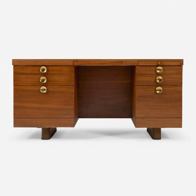 Gilbert Rohde for Herman Miller Executive Office Group Desk, 1942 Teak veneer executive desk with brass-plated steel...