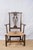 A Country Chippendale style rush seat armchair, early 20th century, American. Features a rush seat and simplified details...