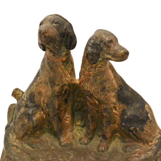 A handsome pair of early-to-mid 20th-century American animalier bookends, meticulously cast in heavy architectural iron....