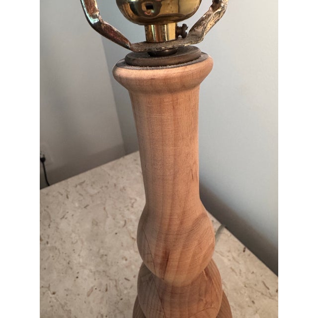 Pair of Scandinavian hand-turned solid wood table lamps. Circa 1960s. Gorgeous wood grain and striking shape. Clear cord....