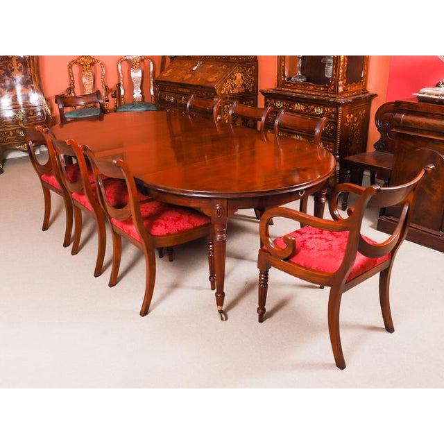 This is an elegant antique regency revival flame mahogany wind-out telescoping movement dining table by selbat, which can...