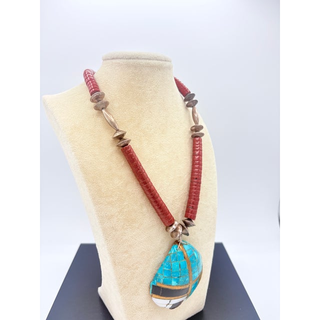 This vibrant mosaic pendant necklace reflects the artisan workshop traditions of the American Southwest. The pendant is...