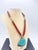 This vibrant mosaic pendant necklace reflects the artisan workshop traditions of the American Southwest. The pendant is...