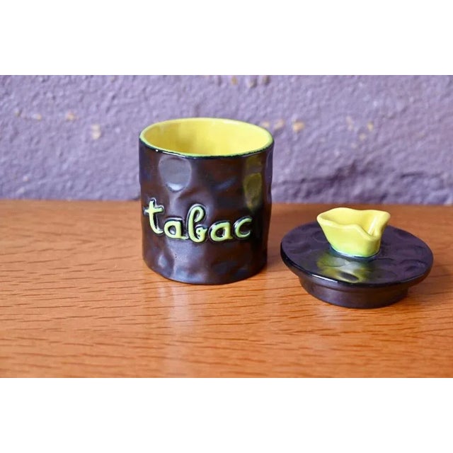 with its tormented shape, slightly bossed, this ceramic tobacco tobacco is an original production full of tone. Midcentury...
