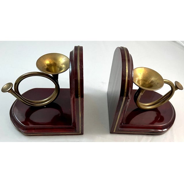 Celebrate the beauty of music and timeless craftsmanship with this **Vintage Wooden French Horn Brass Bookends Set**....