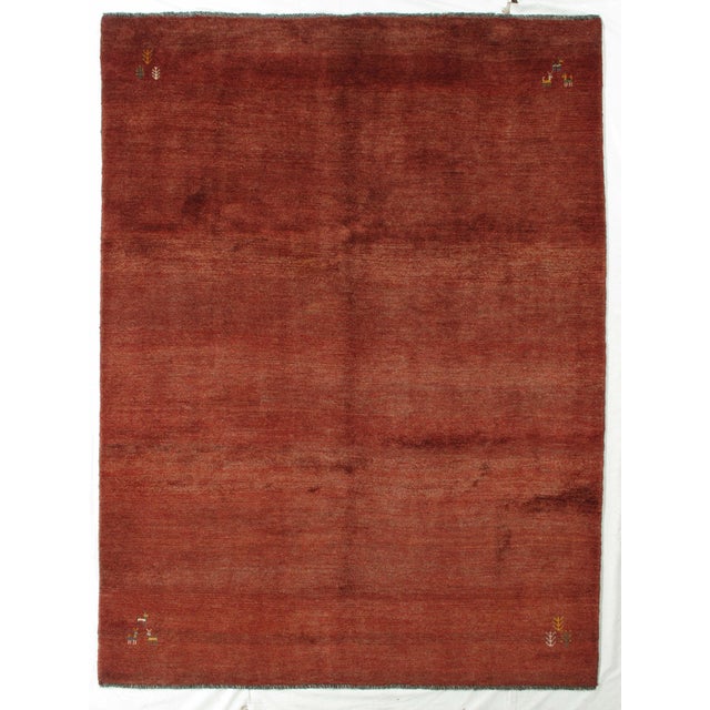 Vintage hand-knotted Persian Gabbeh rug featuring a bold, minimalist field framed by a contrasting border and accented...