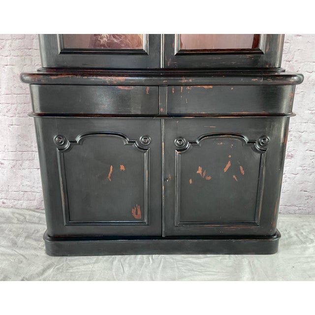 Large handsome English Regency Ebonized Bookcase Cabinet. The height of the cabinet and the ebonized finish sets a...