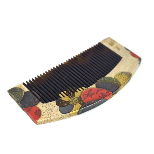 This vintage Japanese kushi (hair comb) is a masterfully crafted piece of traditional wearable art, featuring the...