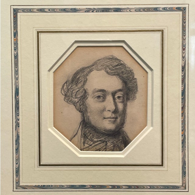 A Pair of matching framed portrait drawings of men, triple matted with marbleized tool lines and gilt frames. The 1980s...