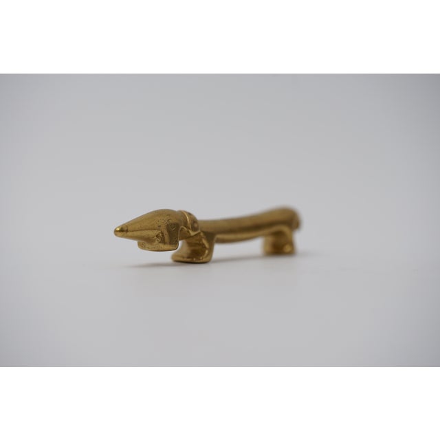 Object: Bottle opener in the shape of a dachshund Designer: Walter Bosse (1904–1979) Age: 1950s/1960s Material: Brass...