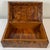 Embrace the timeless glamour of the 1930's with this exquisite French Art Deco jewelry box, handcrafted from amboyna wood....