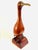 Mid century modern mahogany solid wood Sea Gull sculpture on stand. It has metal beak and glass eyes. The condition is...