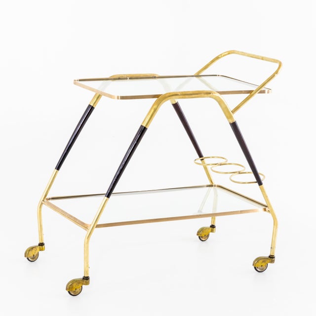 Italian Modernist two tier bar cart attributed to Cesare Lacca. Brass , glass , and wood details.