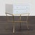 The nightstand features a sleek white lacquered finish, two spacious drawers with gold knobs, and a sturdy gold metal...