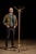 Antique floor-length coat rack with a painted exterior. This piece features six double-sided brass hooks. It sits on a...