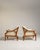 A stylish pair of Danish armchairs featuring soft bouclé upholstery and clean, modern lines. Scandinavian design...