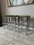Gorgeous set of three Cal-style chrome framed counter height stools with brand new reupholstery in a soft olive green...