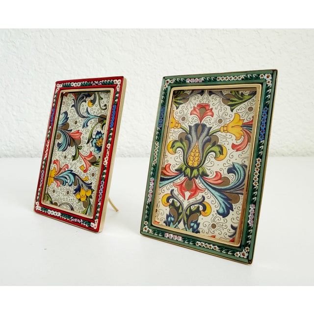 A pair of vintage circa 1960s-1970s picture frames featuring micro mosaic glass frames with brass backing, adjustable...