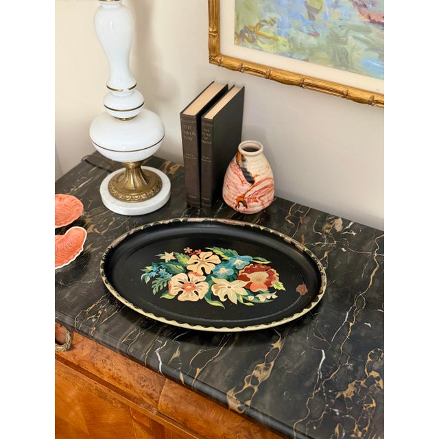 Featuring a floral motif and beautifully worn, chippy paint, this piece has the kind of authentic patina that only comes...