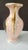 A late Victorian porcelain vase, likely Bohemian, dating to circa 1900. The piece features a blush pink ground, hand-...