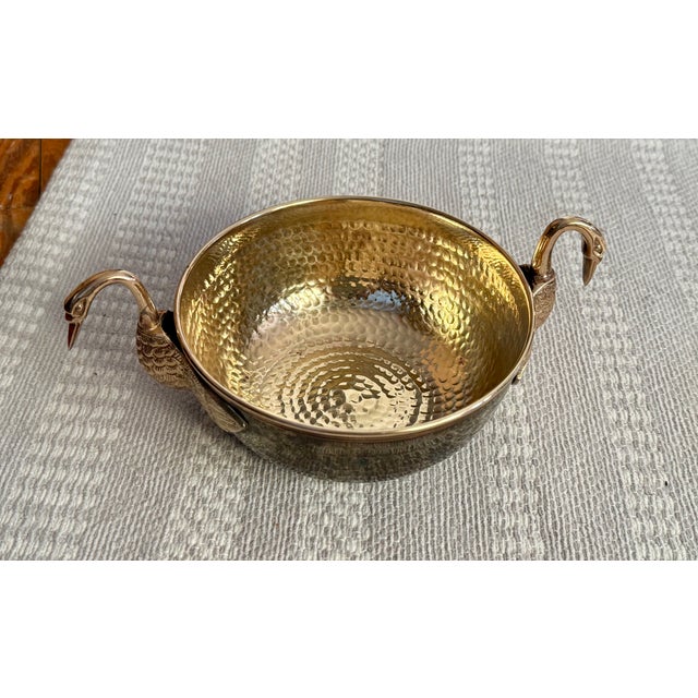Vintage Hammered brass bowl in excellent condition. Beautiful and distinct swan heads with wings as handles. Original...