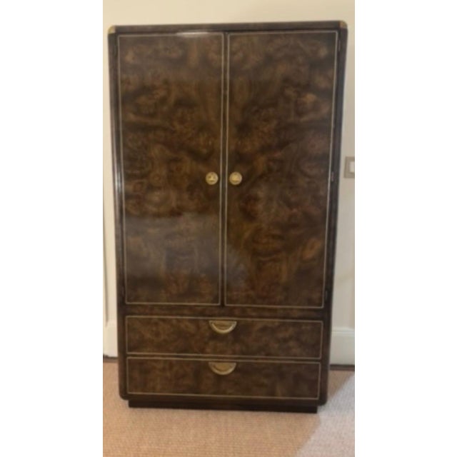Attributed to Mastercraft (by John Widdicomb) by appraiser. Burled Amboyna Armoire with inlaid brass trim and handles. MCM...