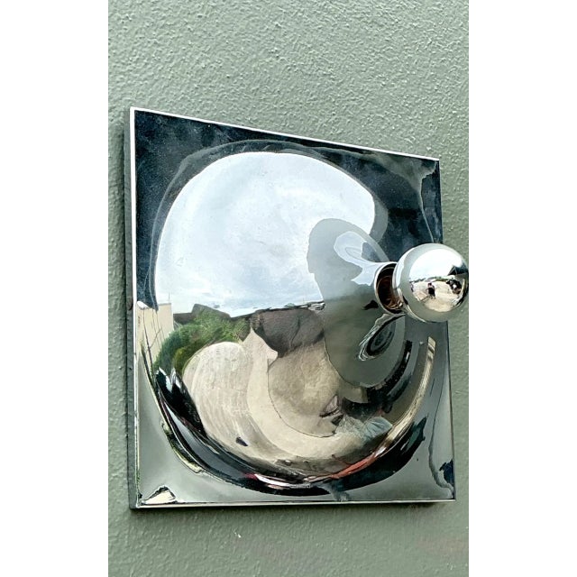 Crafted in gleaming chrome, this vintage wall sconce brings a clean Mid-Century Modern presence to the room. Its square...