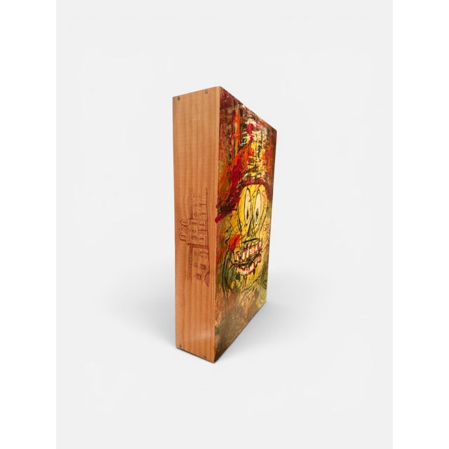 Painted directly onto a wooden wine crate, this original work by Kevin Murphy features a bold, expressive figure with...
