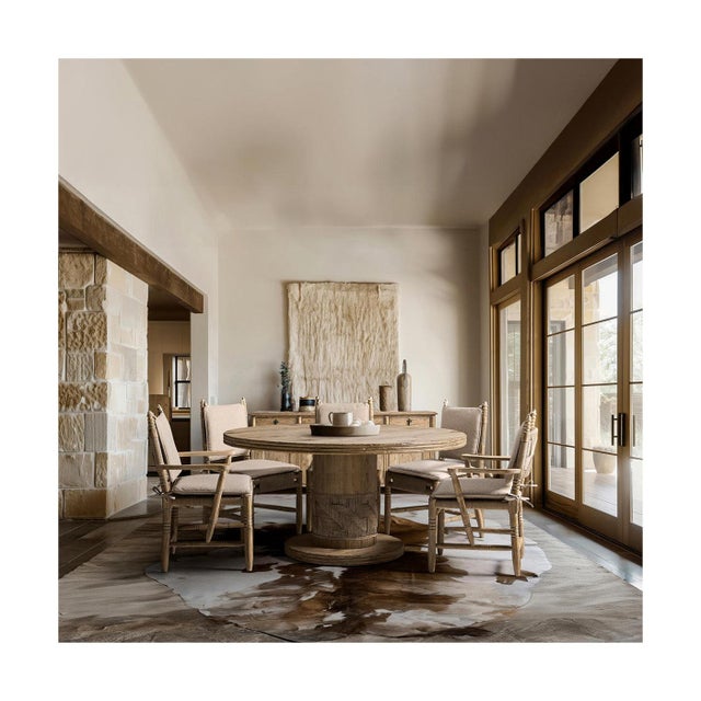 The pedestal dining table brings a sculptural look and a grounded feel to your dining area. Its thick, round wood top has...