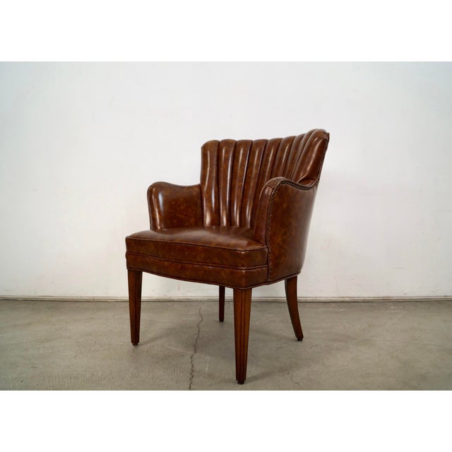 Vintage 1960's Mid Century Modern club armchair for sale. It has the original naugahyde faux leather, and is in excellent...