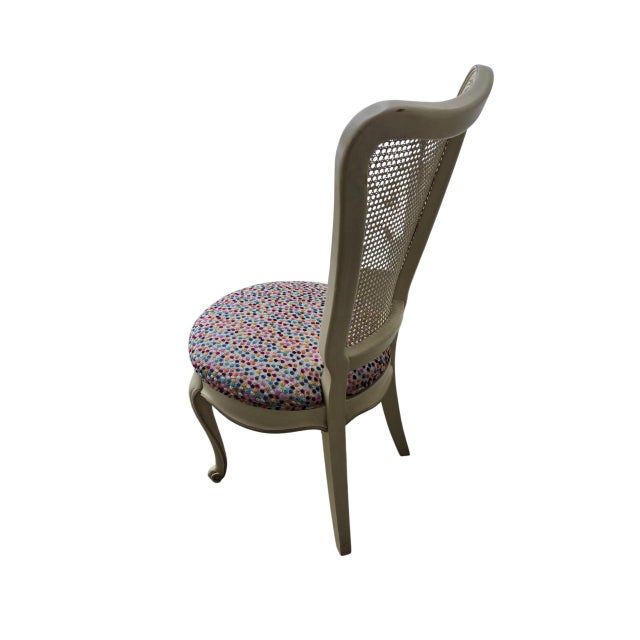 Curved back caned Vanity chair. I like its form. Curved fluted back..I like the creamy white paint with silver highlights....