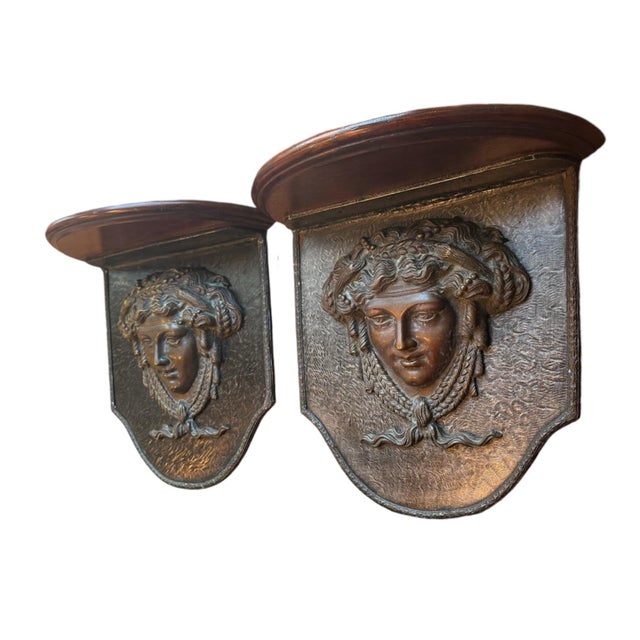 A chic pair of Mid-Century Versace-style wall corbels with solid bronze Medusa heads and mahogany stained demi-lune...