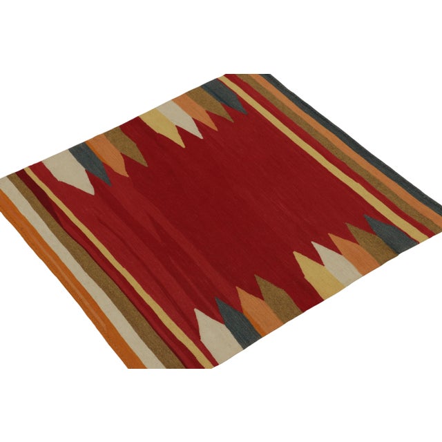 Handwoven in wool circa 1980-1990, from a rare vintage curation of small-sized Kilims newly unveiled from our classic...