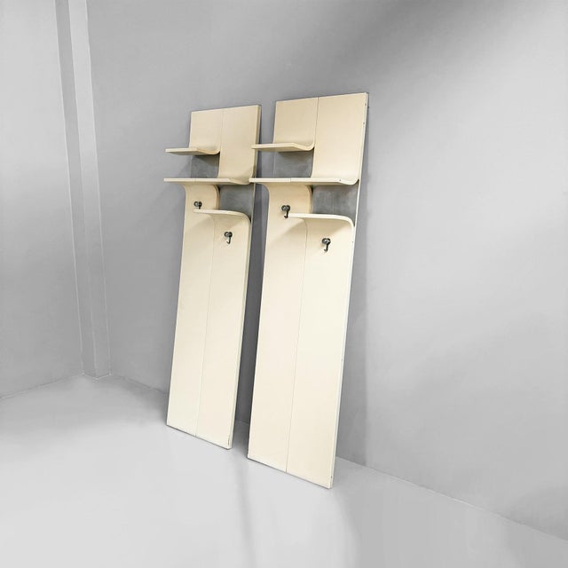 Italian modern wall-mounted coat rack in white wood and metal, 1970s Pair of wall-mounted coat racks with a rectangular...