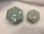 A pair of handmade soft green celadon porcelain boxes with a rich luster and overall crackle glaze. Smaller box is 2.75”...