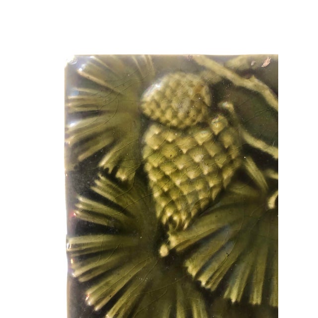 Mintons Antique Glazed Earthenware Tile. Arts Crafts / Art Nouveau Pinecone leaf Design. Circa late 1800's/Early 1900's....